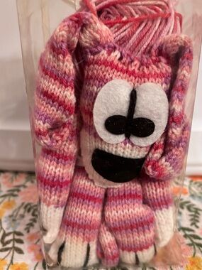 Wendy Four Legged
Friends Scarf Kit with pink, red, and white striped yarn
